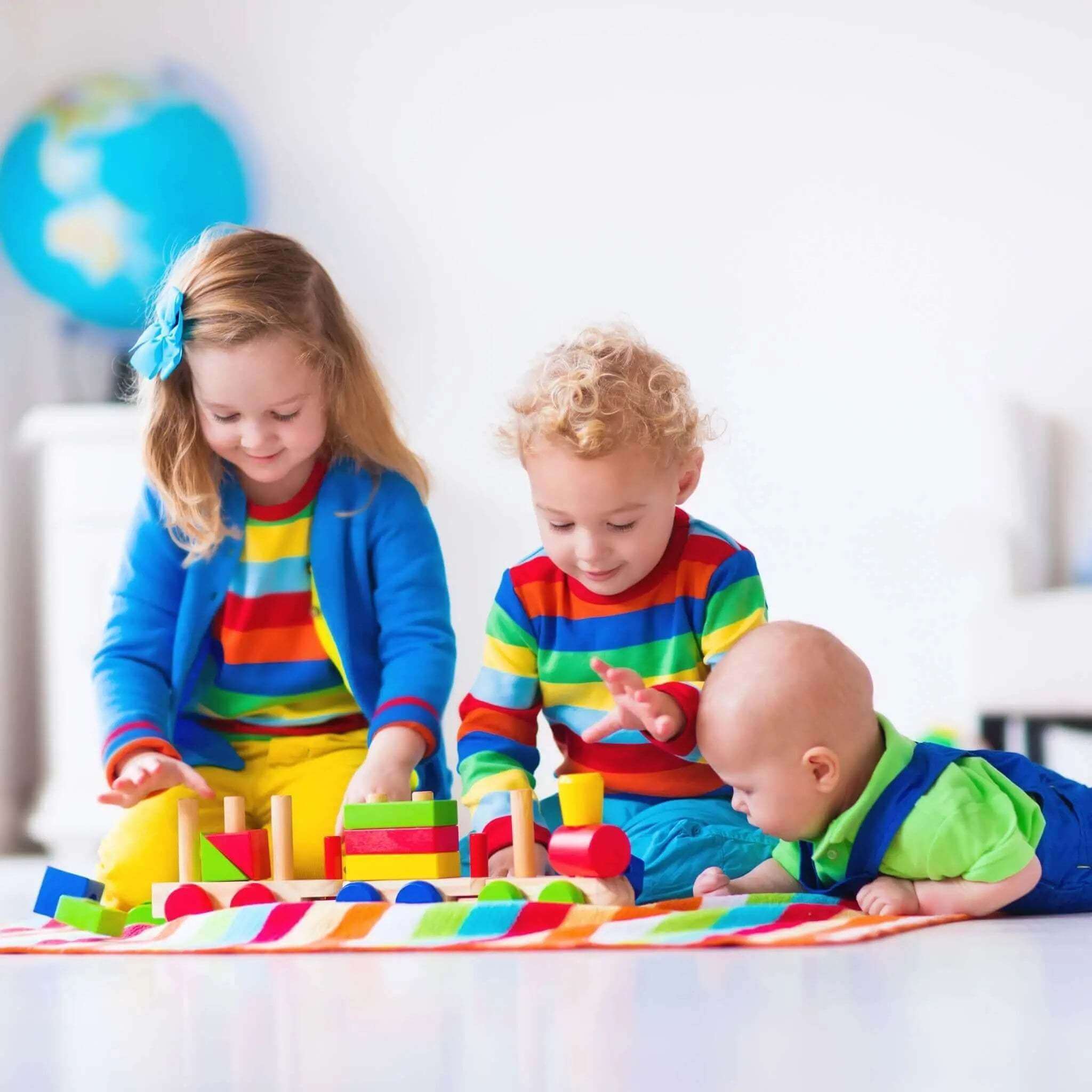 Children playing with colorful building blocks, exploring creativity through toys and games at pkamazone.