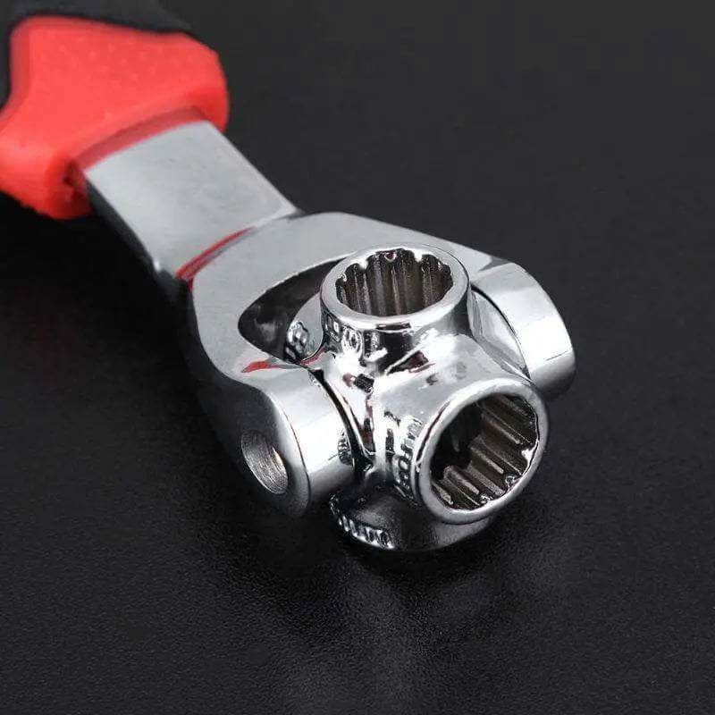 Universal wrench with swivel head and rotating adjustments, black and red handle on black background.