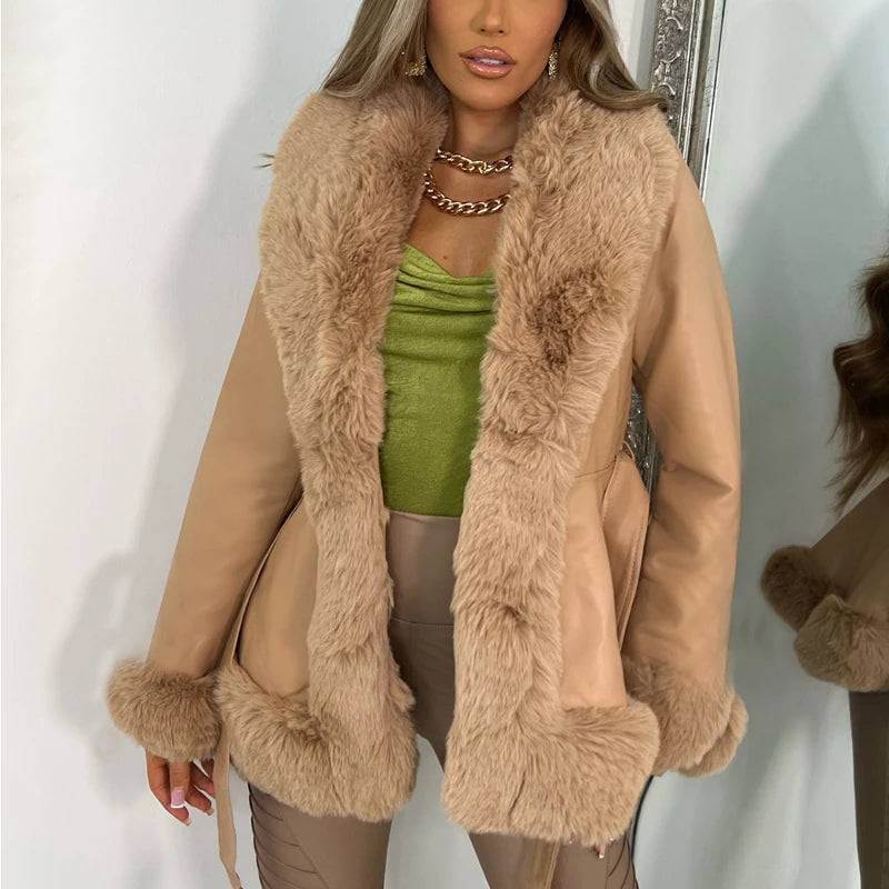 Model wearing a stylish Autumn/Winter PU Leather Coat with a large fur collar and lace-up waist detail.