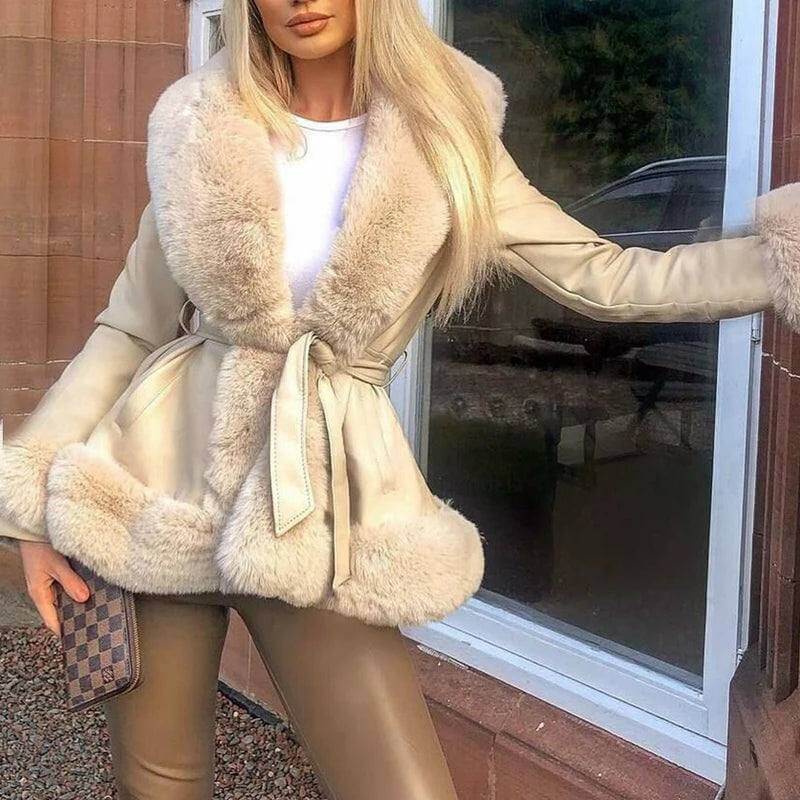 Stylish woman wearing a 2023 Autumn/Winter PU Leather Coat with a fur collar and lace-up waist detail.
