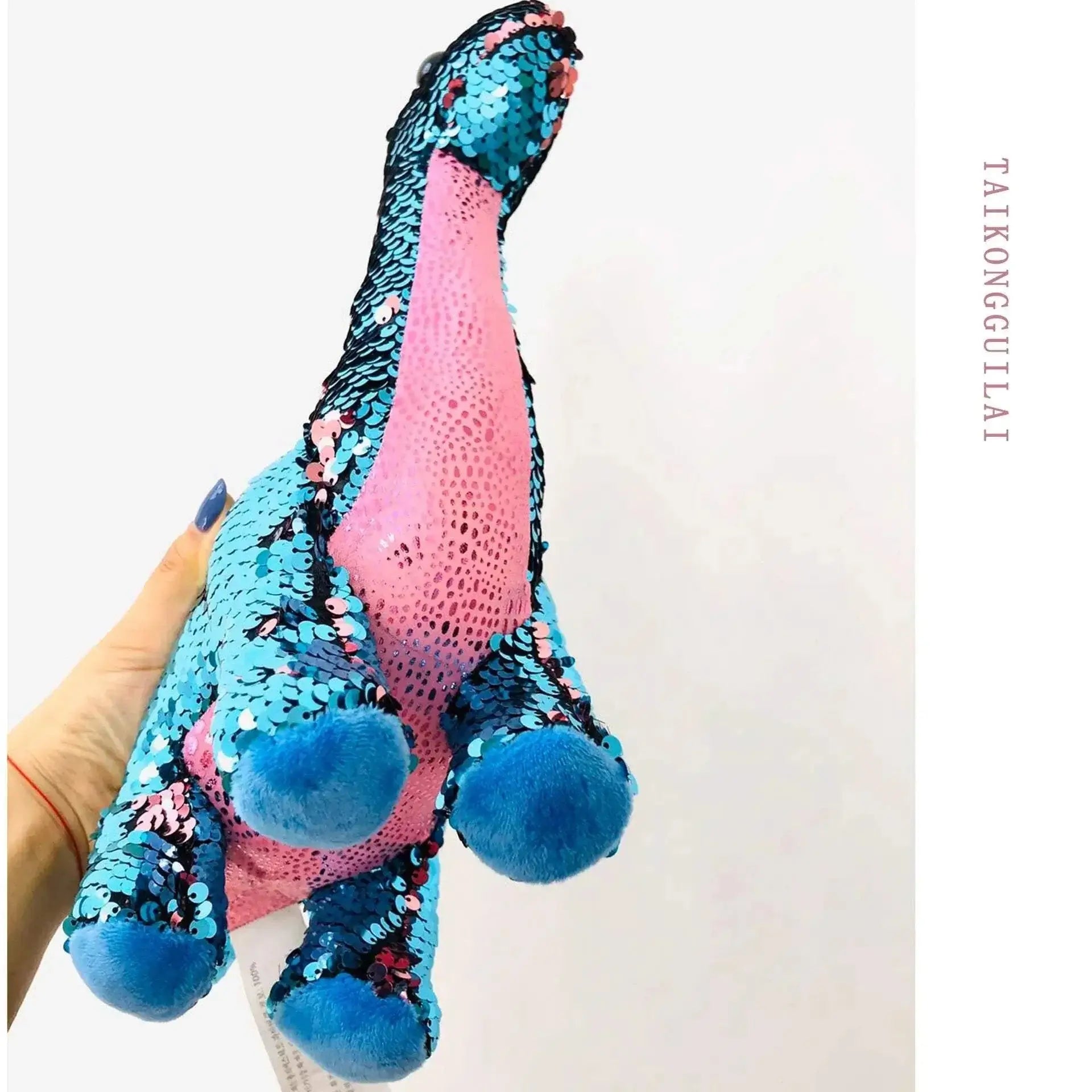 Sequin Dinosaur Color Changing Pillow in blue and pink, showcasing vibrant sequins and plush design.