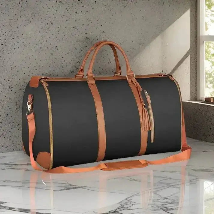 Foldable Travel Duffle Bag with leather accents on marble surface