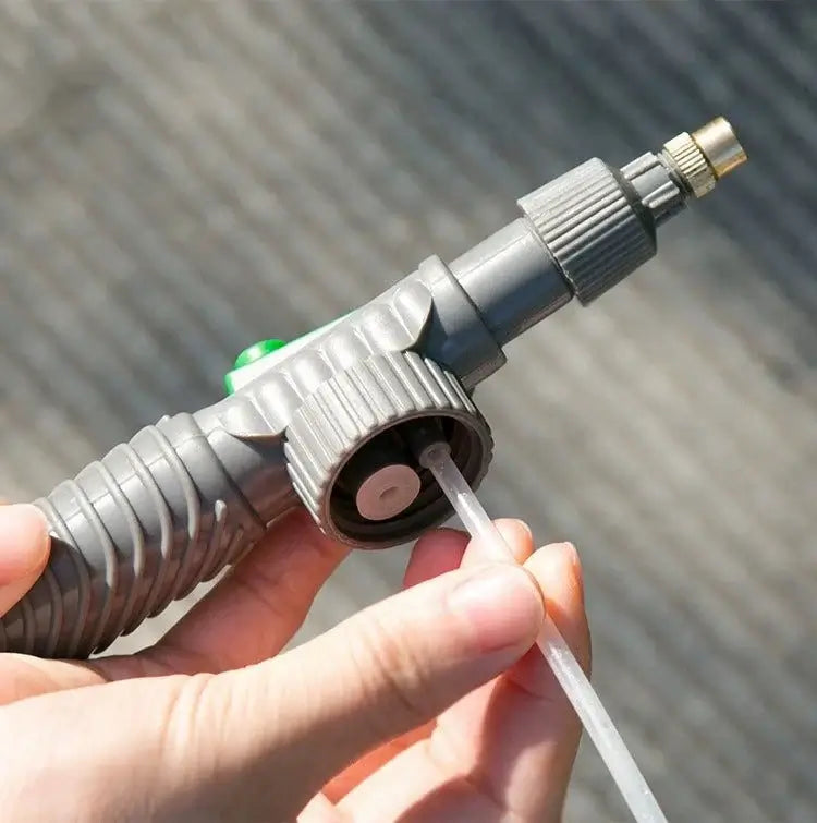 Beverage Bottle Sprayer nozzle for watering plants, disinfection, and car washing, showing hand-held grip design.