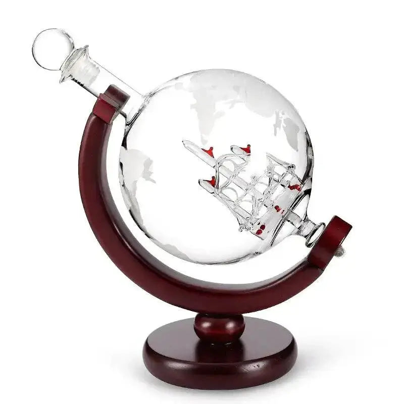 Whiskey decanter globe wine aerator glass set with sailboat design and wooden stand.