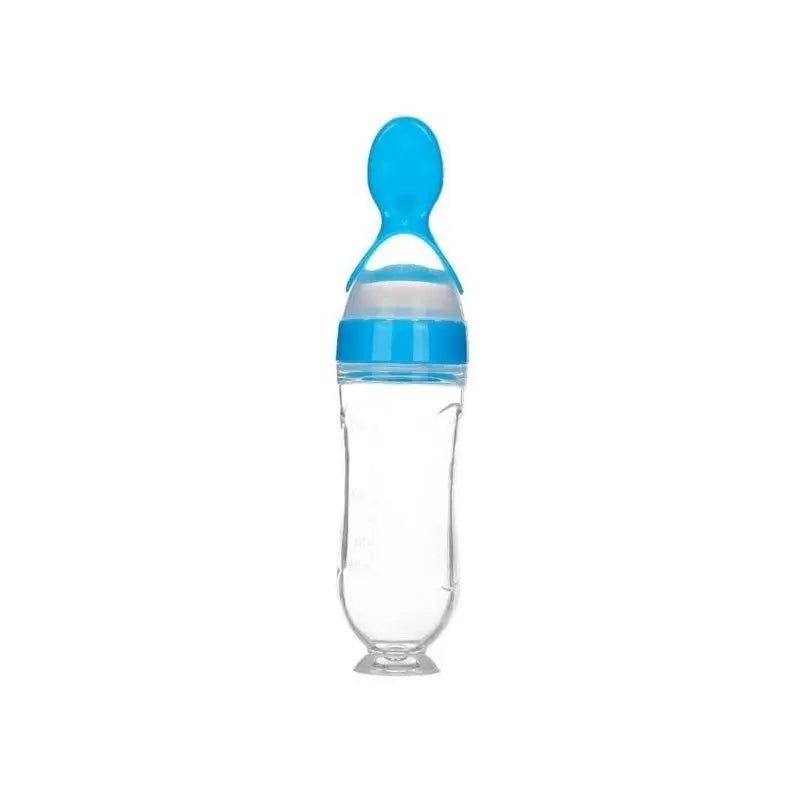 Baby squeezing feeding bottle with soft silicone spoon attachment.
