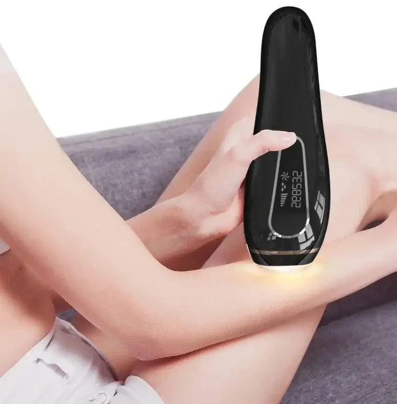 Home laser hair removal device in use on a woman's arm for smooth, hair-free skin.