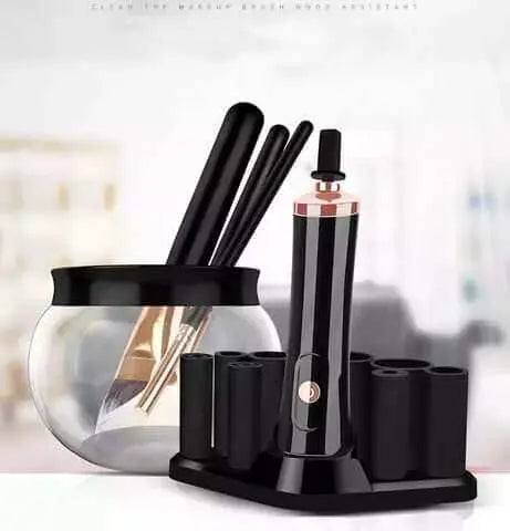 Electric makeup brush cleaning device with brush holder and cleaning bowl.