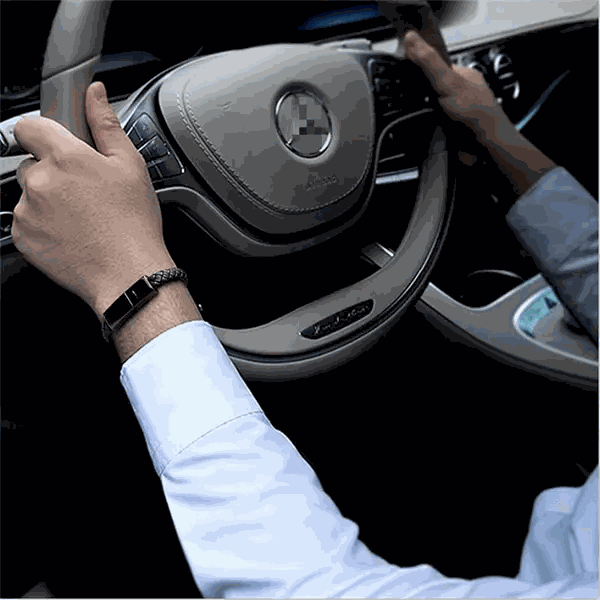 Leather Mini USB bracelet worn while driving, showcasing its stylish and functional design.