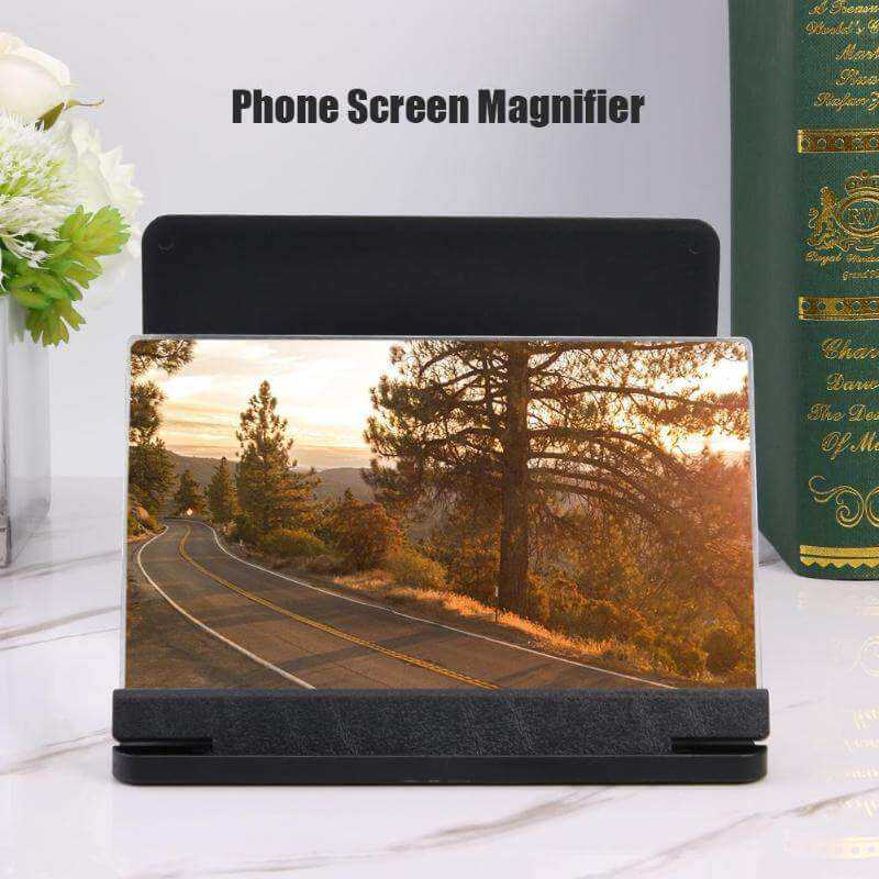 Mobile screen amplifier showcasing enhanced viewing on a phone, with a scenic road image displayed.