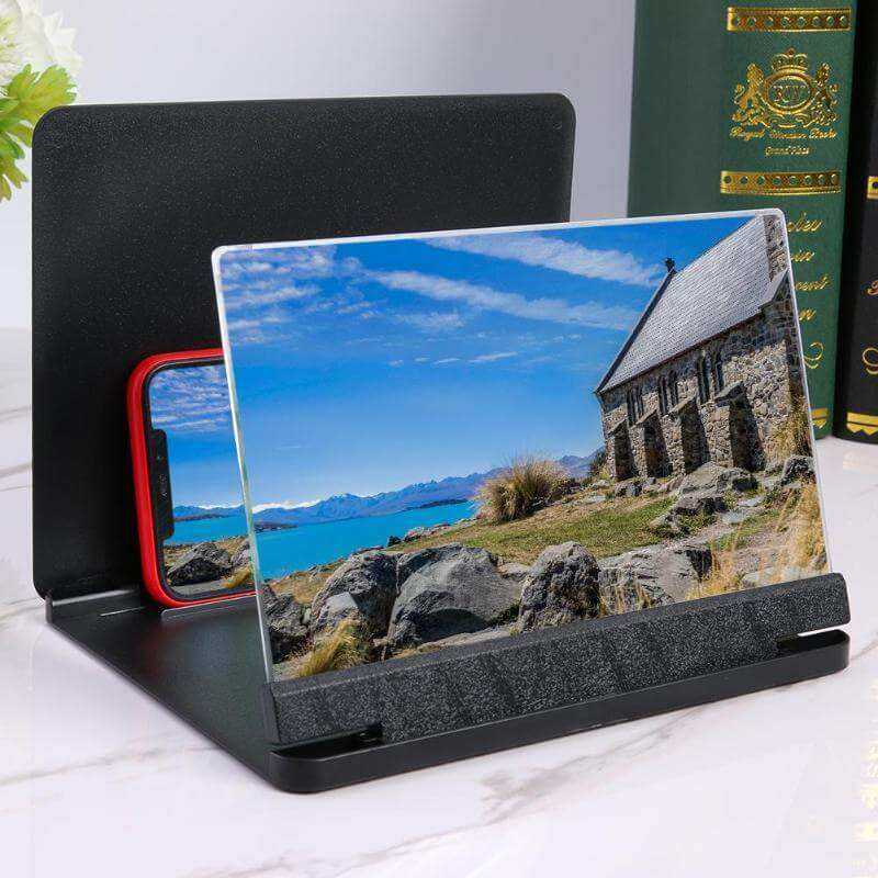Mobile screen amplifier with 3D magnification, enhancing viewing experience for smartphones.