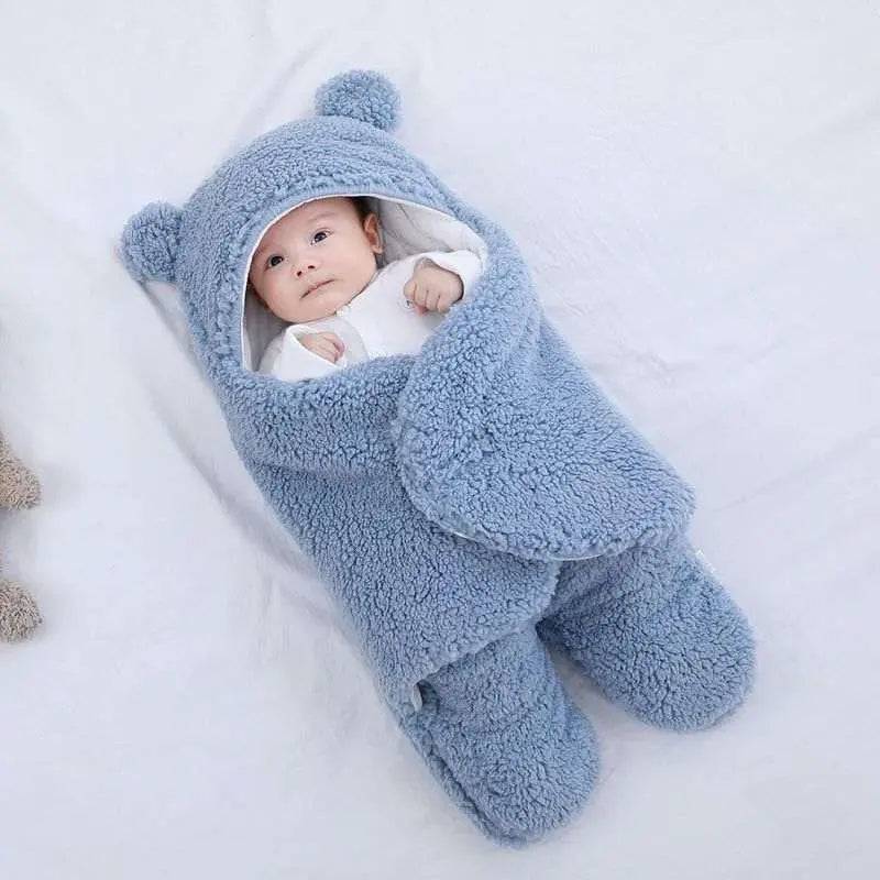 Ultra-soft blue starfish baby sleeping bag with cozy design, featuring intimate hat and detachable sleeves.