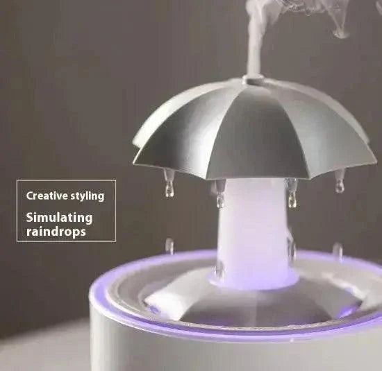 Rotating aroma humidifier with creative umbrella design simulating raindrops.
