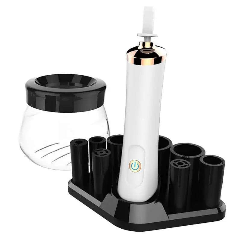 Electric makeup brush cleaning device with spinner and brush bowl on black stand.
