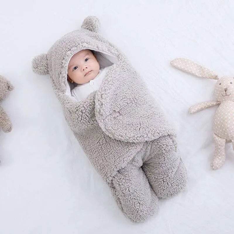 Ultra-soft starfish baby sleeping bag with hood, providing warmth and comfort for infants.