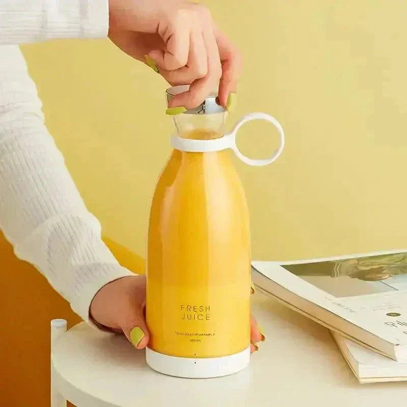 Portable fresh fruit blender with rechargeable design for smoothies and juices.
