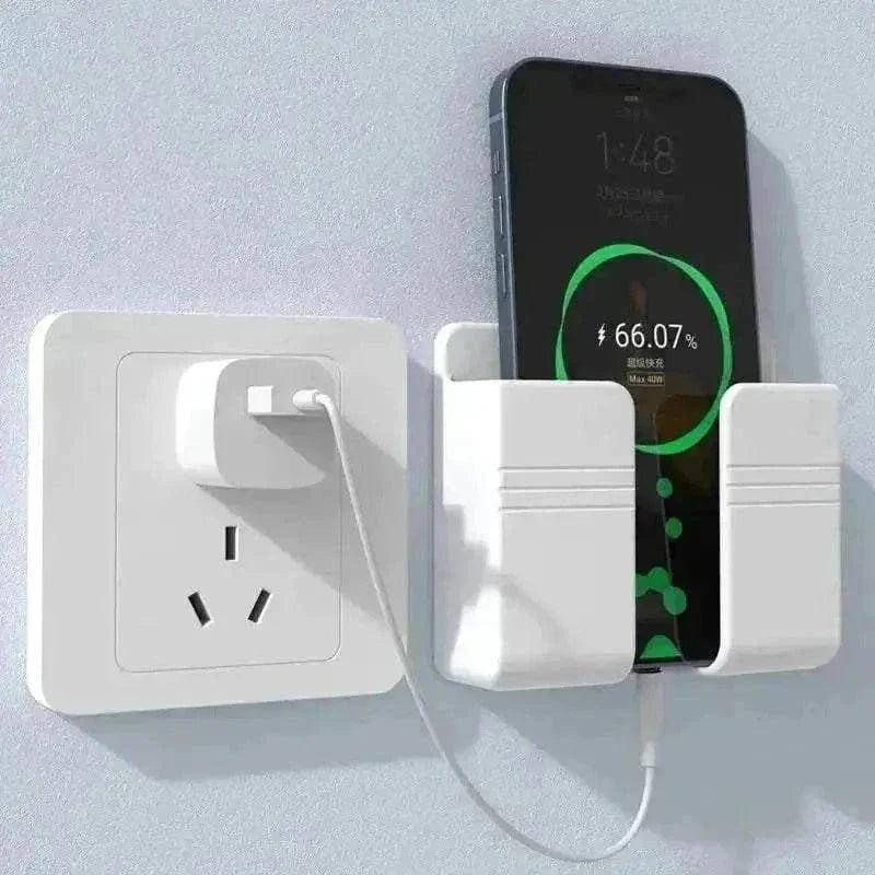 Wall-mounted phone holder by an electrical outlet with charging phone.