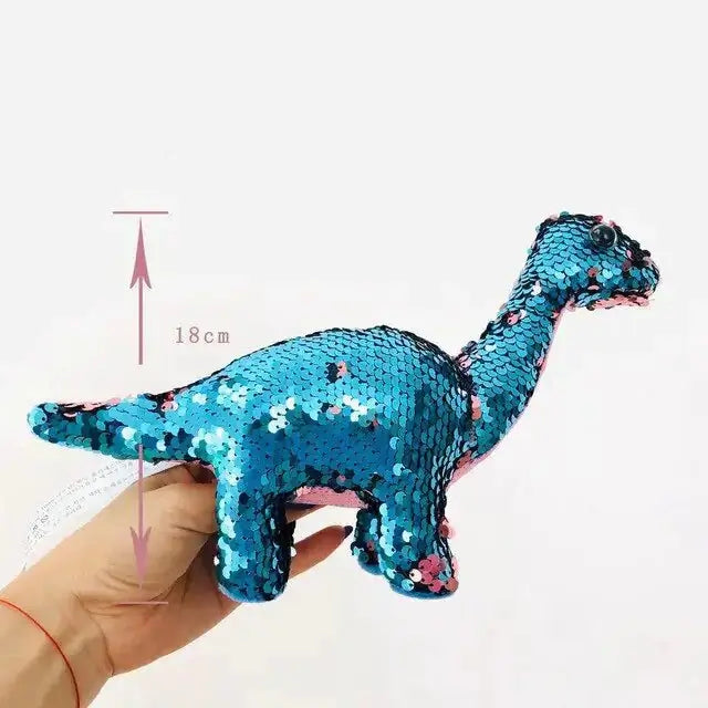 Sequin Dinosaur Color Changing Pillow Toy in hand, 18cm size, shimmering blue sequins.