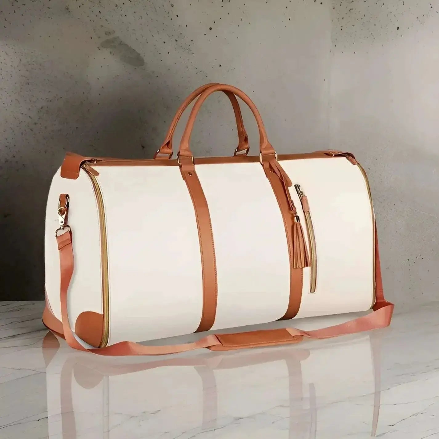 Foldable travel duffle bag with brown straps, spacious interior, and water-resistant construction, perfect for organized packing and easy storage.