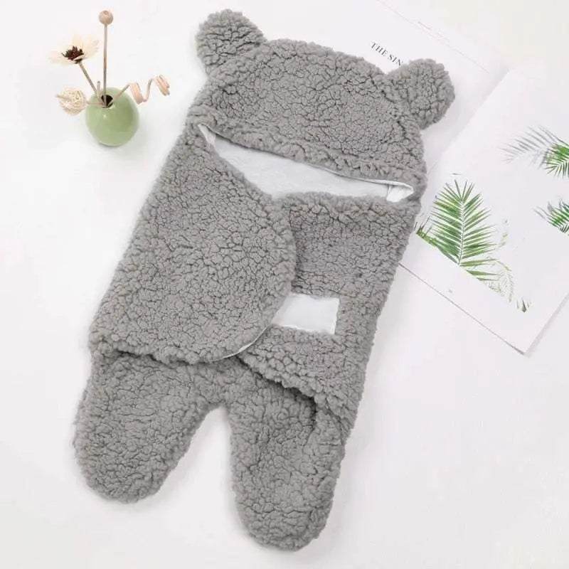 Ultra-soft starfish-shaped baby sleeping bag with cozy cotton layers and detachable sleeves.